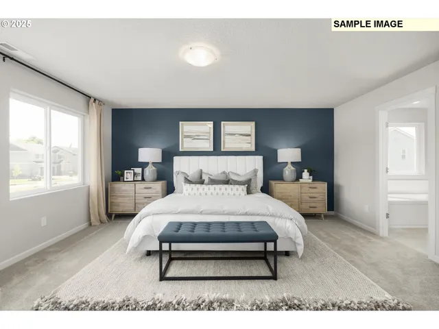 a bedroom with a bed a table and window