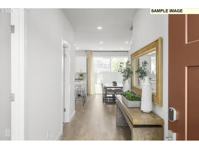 a open hall with dining table and chairs