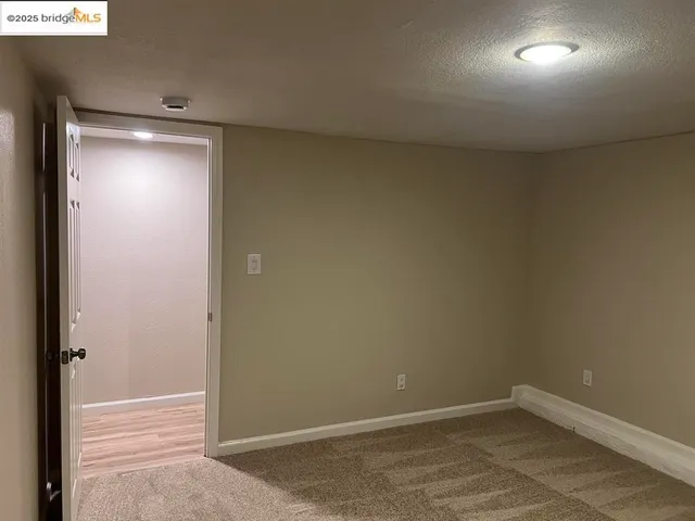 a view of a bathroom with sink and mirror