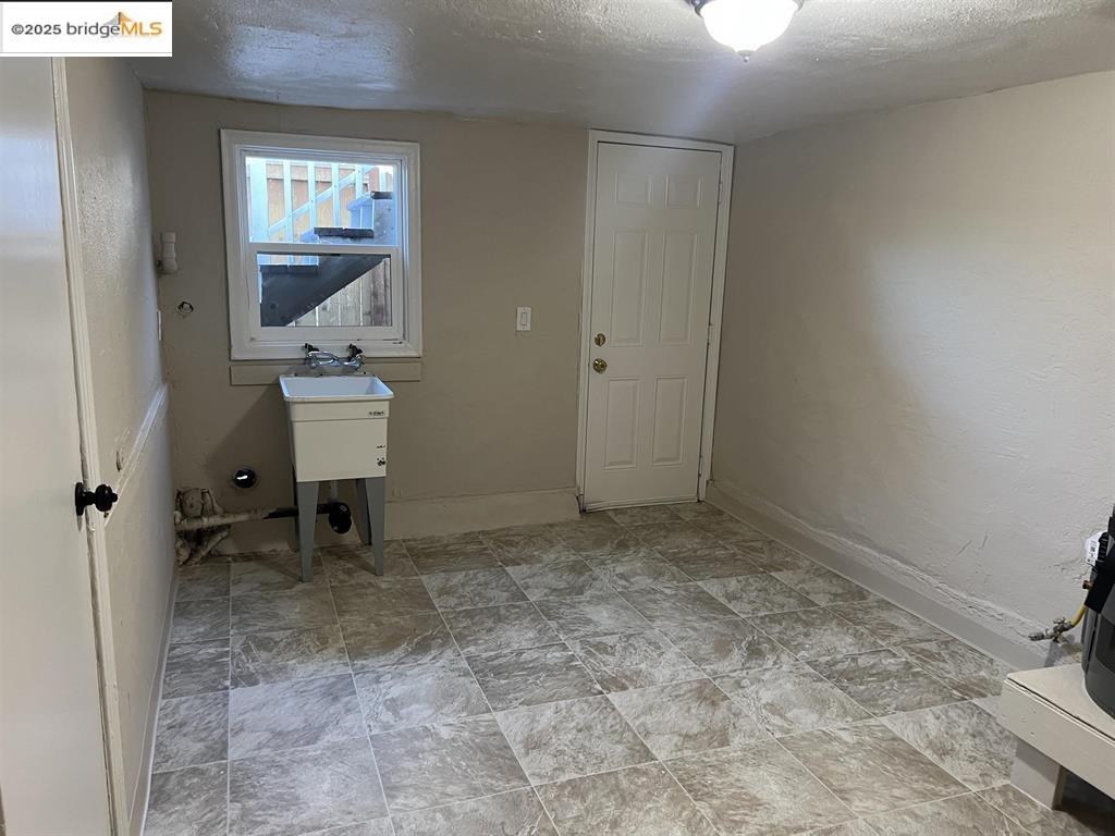 449 East 9th Street Pittsburg, CA 94565 - Photo 16 of 17 a view of a bathroom with sink and mirror