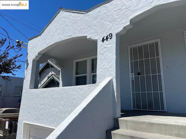 a view of an empty room and wooden floor