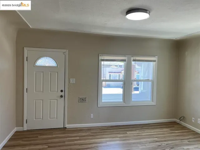 a kitchen with granite countertop cabinets stainless steel appliances and a counter space
