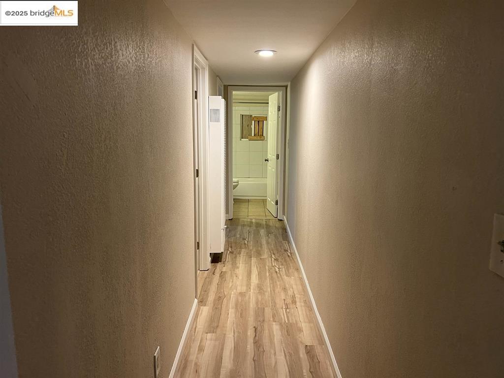 449 East 9th Street Pittsburg, CA 94565 - Photo 10 of 17 a view of a hallway with wooden floor