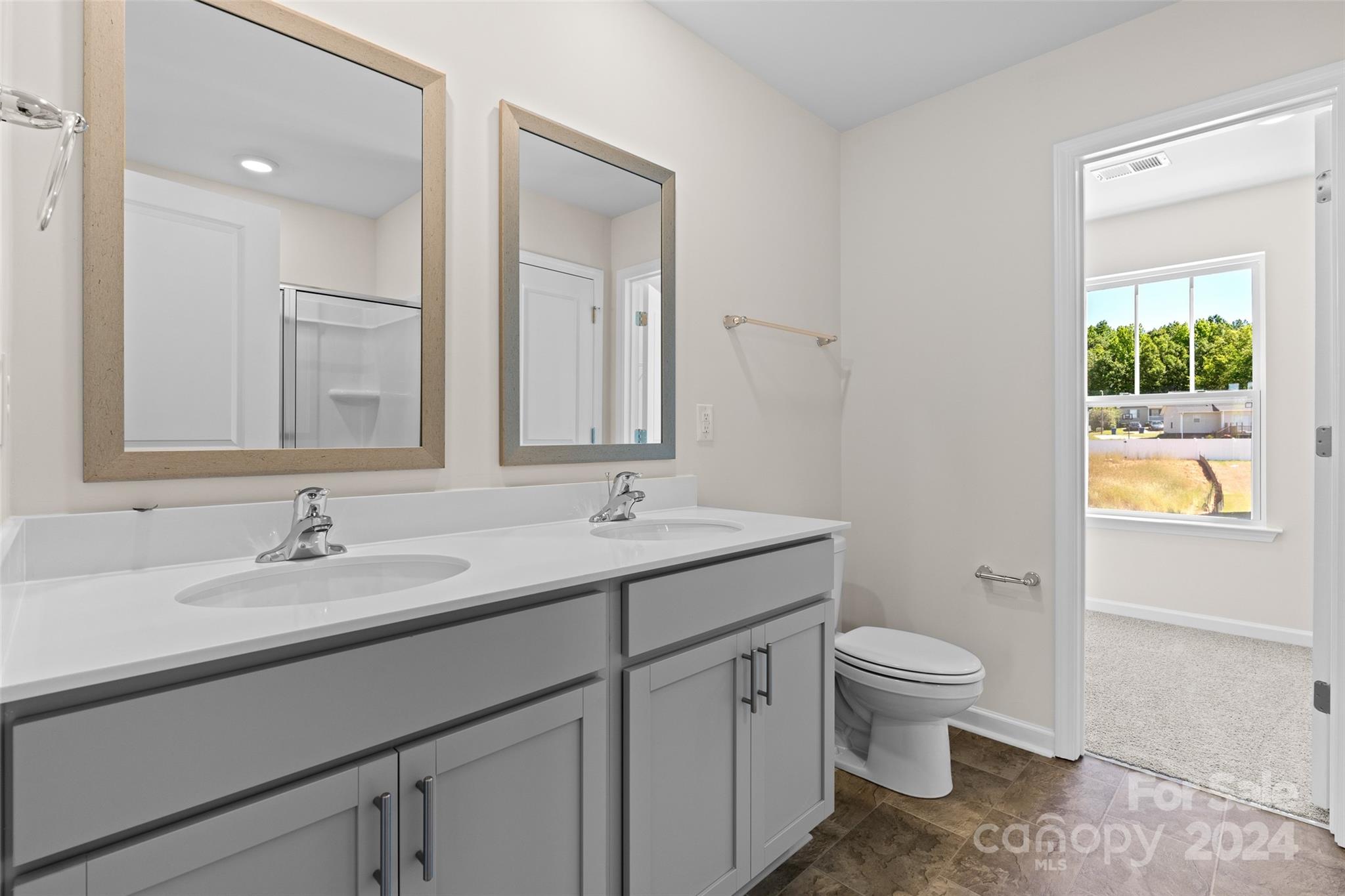 100 Callie River Clyde, NC 28721 - Photo 15 of 22 a bathroom with a toilet sink and mirror