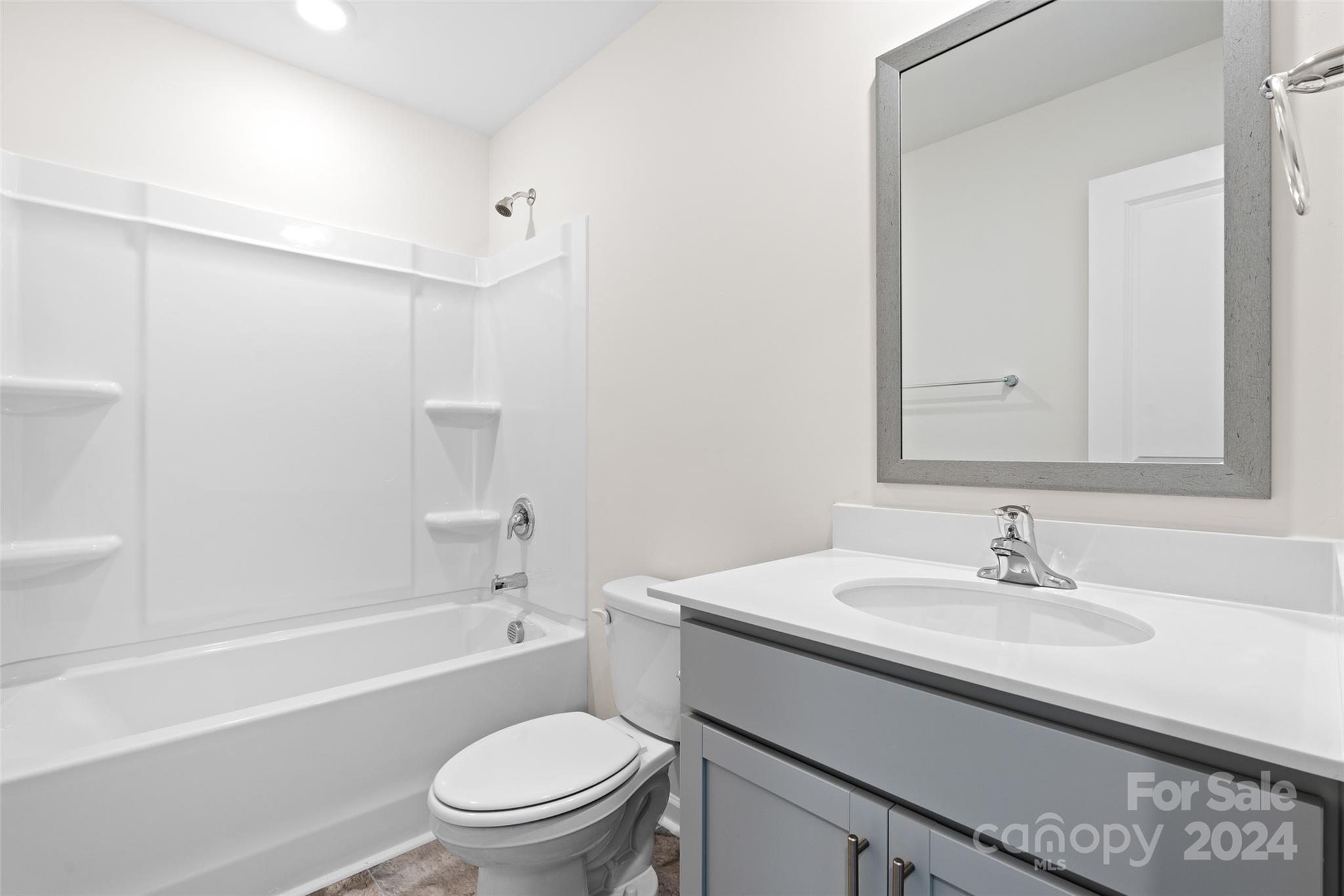 100 Callie River Clyde, NC 28721 - Photo 20 of 22 a bathroom with a sink a toilet and shower