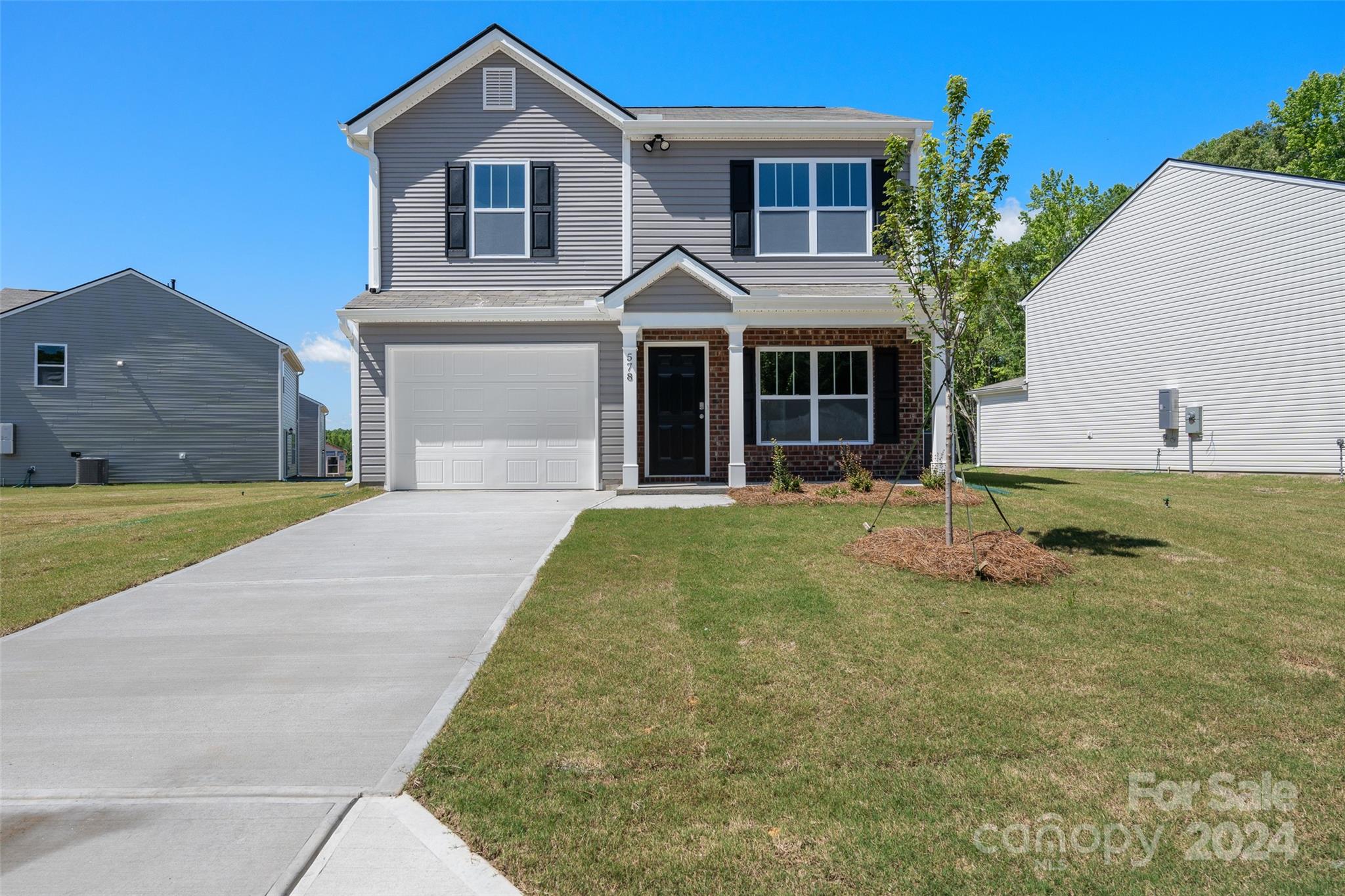 100 Callie River Clyde, NC 28721 - Photo 2 of 22 a front view of a house with a yard and garage