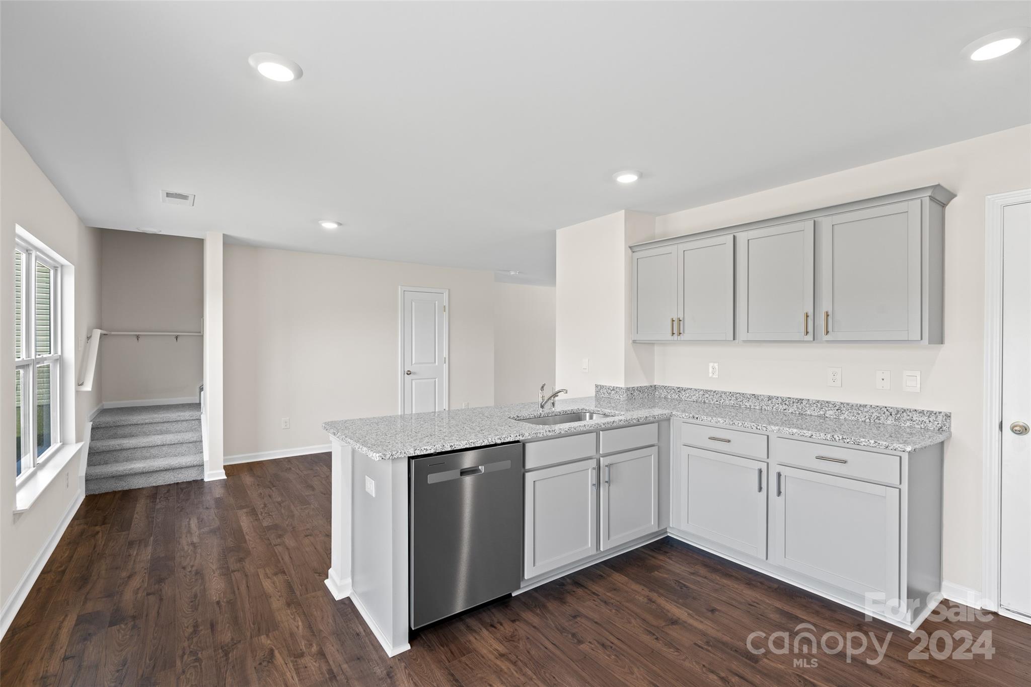 100 Callie River Clyde, NC 28721 - Photo 10 of 22 a kitchen with a sink stainless steel appliances and cabinets