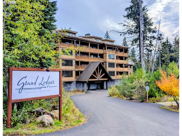 a view of outdoor space with signage and flags