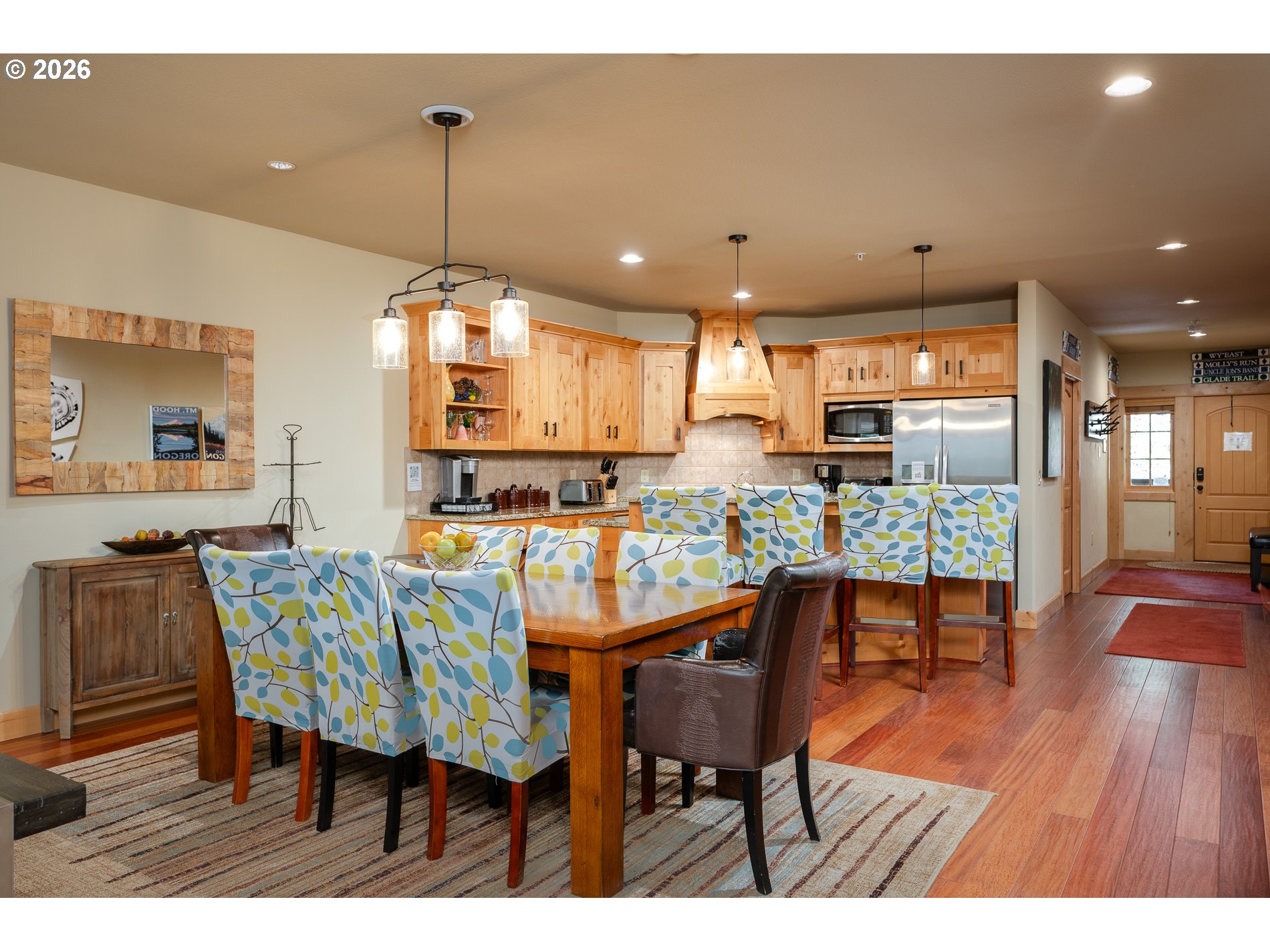31250 East Collins Lake Road, Unit 6 Government Camp, OR 97028 - Photo 11 of 35 a view of a dining room with furniture and wooden floor