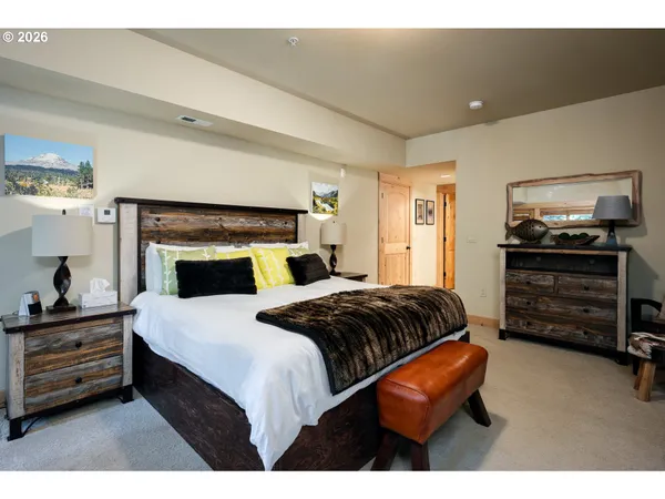 a bedroom with a bed and a television