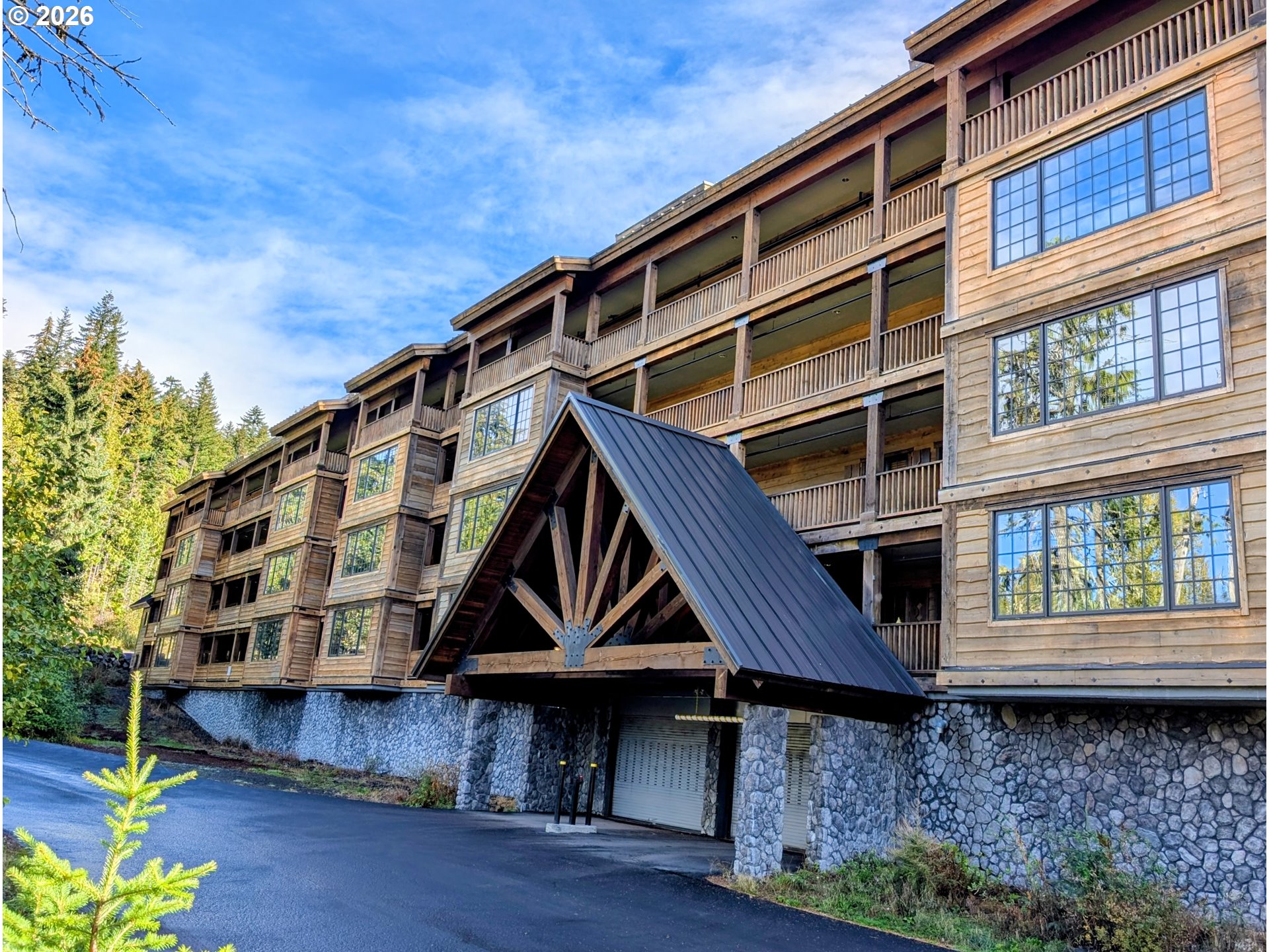 31250 East Collins Lake Road, Unit 6 Government Camp, OR 97028 - Photo 2 of 35 a front view of house with wooden stairs and windows