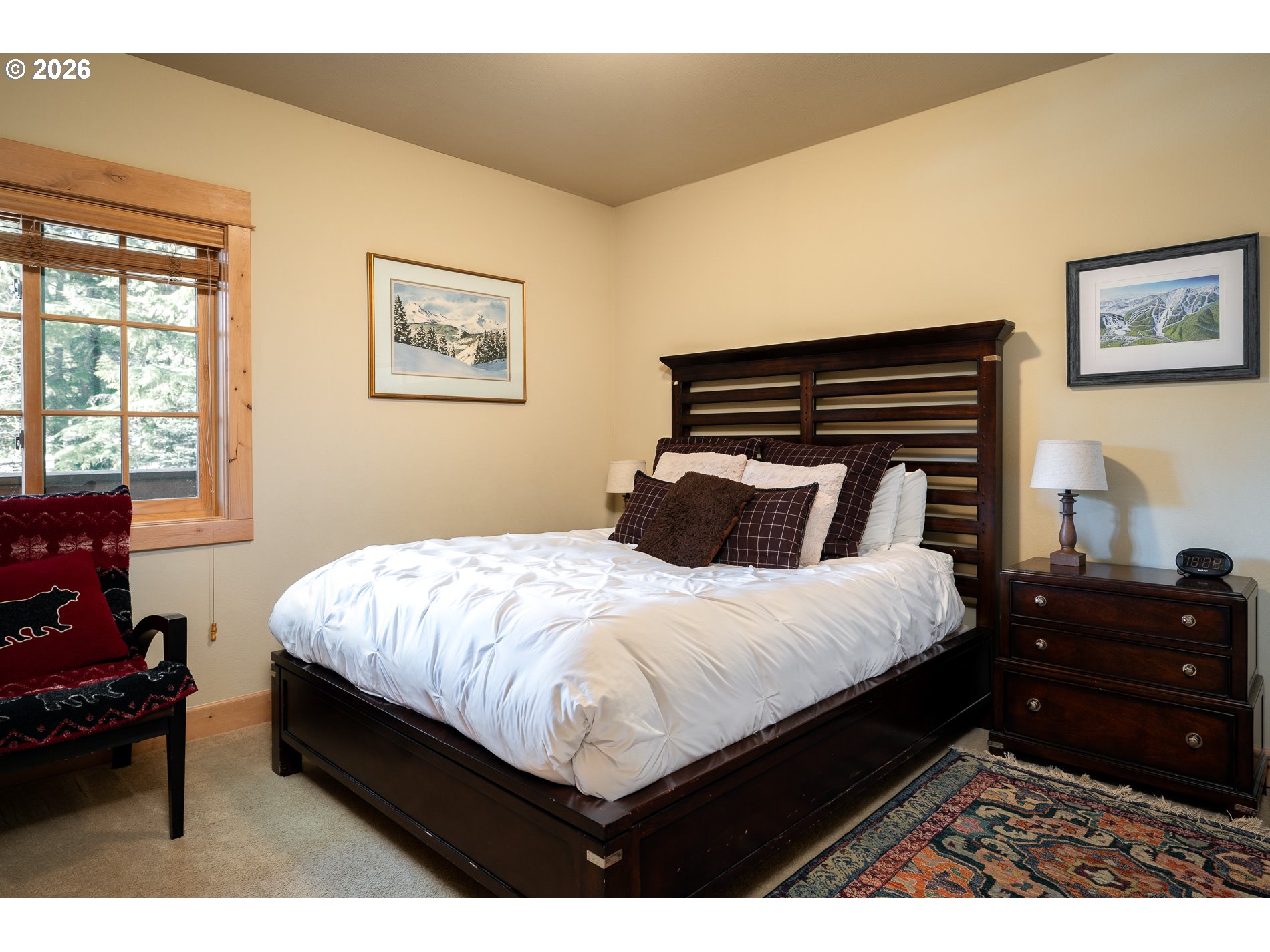 31250 East Collins Lake Road, Unit 6 Government Camp, OR 97028 - Photo 22 of 35 a bedroom with a bed painting on wall and a large window