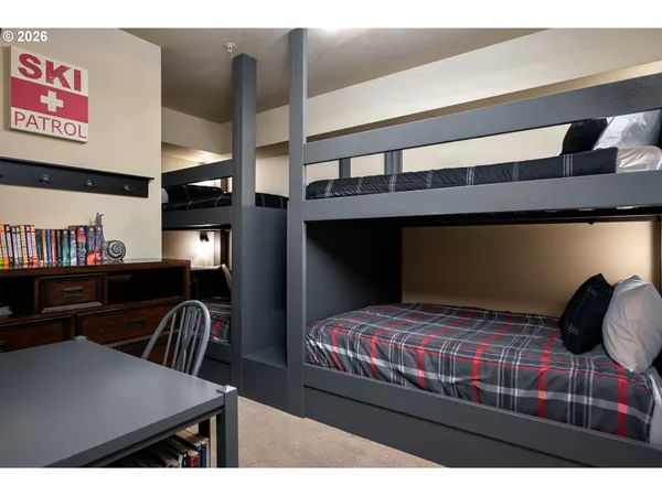 a bathroom with a granite countertop sink a mirror and a shower