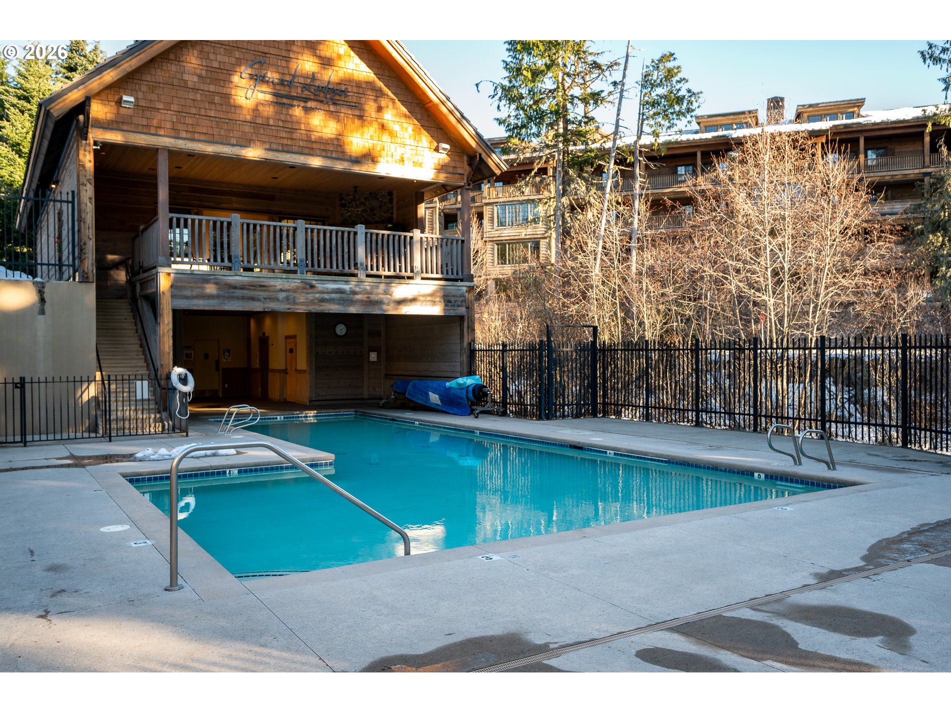31250 East Collins Lake Road, Unit 6 Government Camp, OR 97028 - Photo 33 of 35 a view of a house with a swimming pool