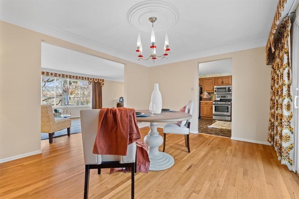 104 Dounreay Place Pittsburgh, PA 15237 - Photo 11 of 43 a view of a dining room with furniture window and wooden floor