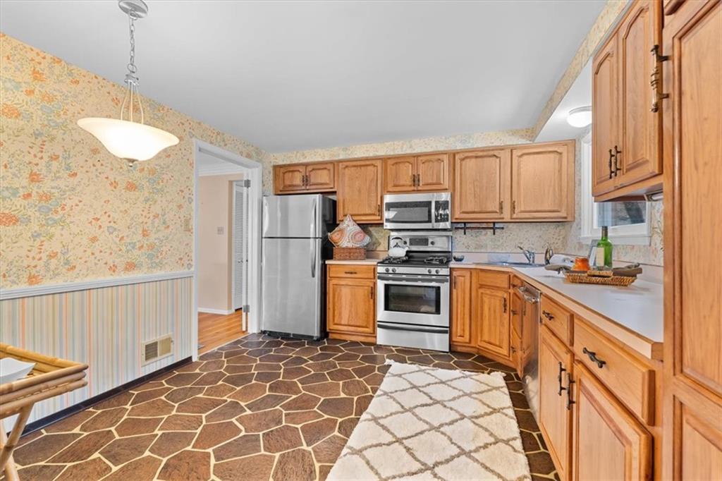 104 Dounreay Place Pittsburgh, PA 15237 - Photo 14 of 43 a kitchen with stainless steel appliances granite countertop a refrigerator and a stove top oven