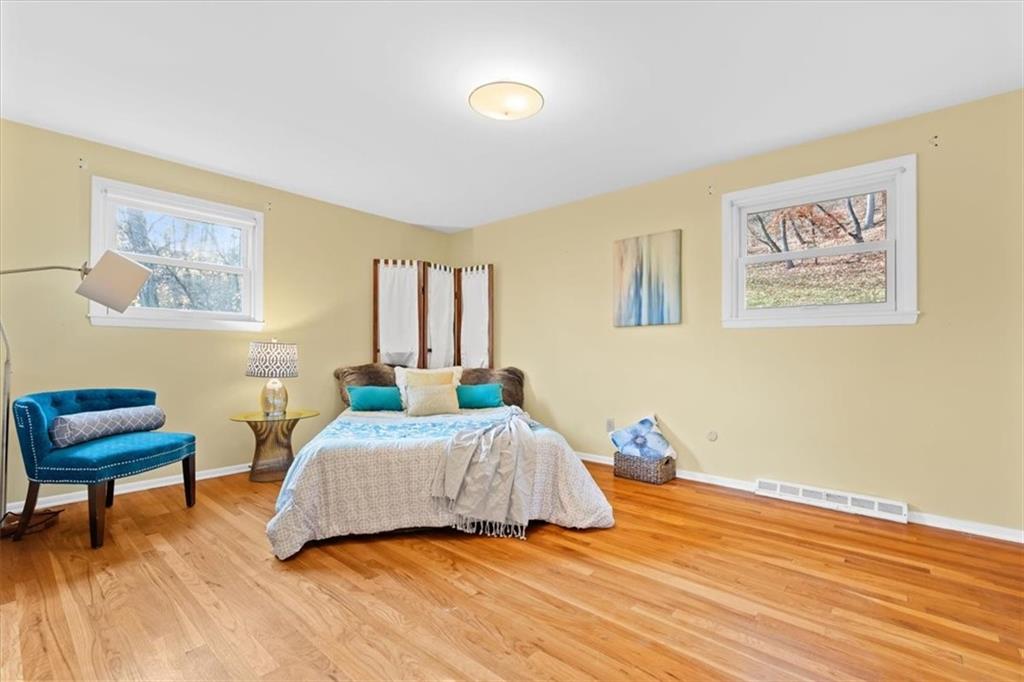 104 Dounreay Place Pittsburgh, PA 15237 - Photo 19 of 43 a bedroom with a bed and a chair