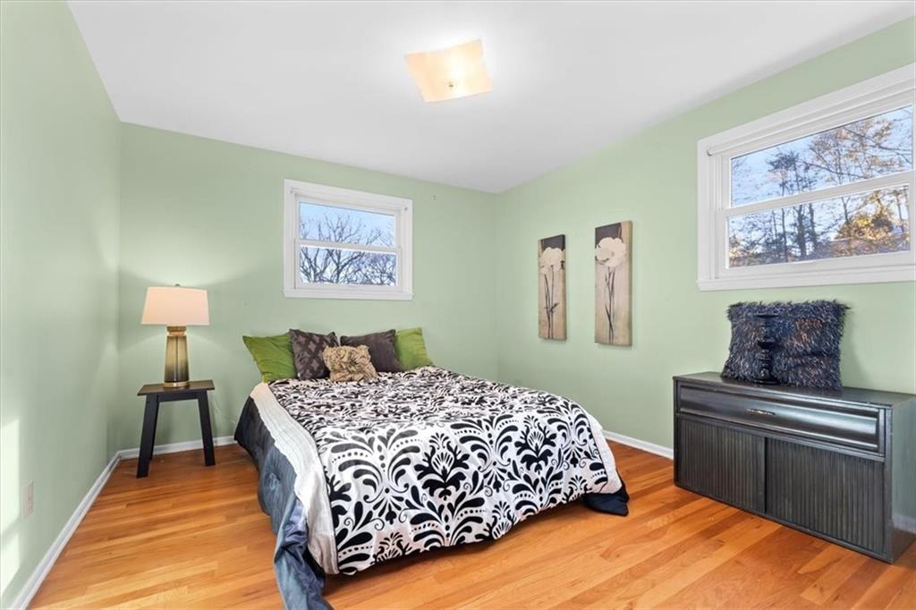 104 Dounreay Place Pittsburgh, PA 15237 - Photo 21 of 43 a bedroom with a bed and a lamp on table