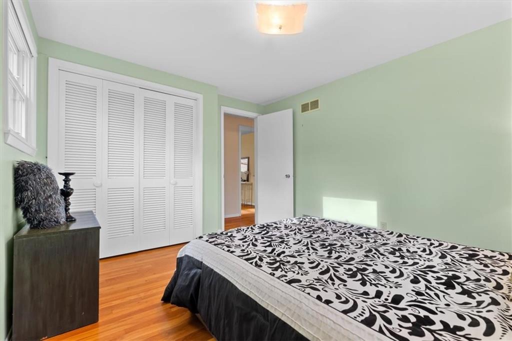 104 Dounreay Place Pittsburgh, PA 15237 - Photo 22 of 43 a bedroom with a bed and wooden floor