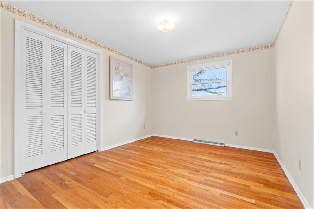 104 Dounreay Place Pittsburgh, PA 15237 - Photo 25 of 43 a view of empty room with wooden floor