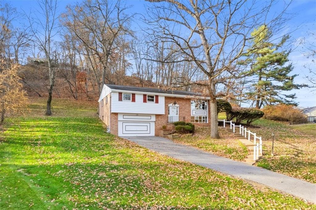 104 Dounreay Place Pittsburgh, PA 15237 - Photo 40 of 43 a view of a house with a yard covered with snow in the yard