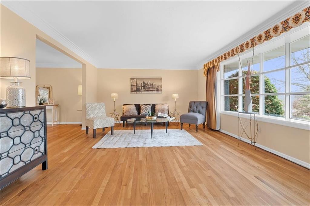 104 Dounreay Place Pittsburgh, PA 15237 - Photo 4 of 43 a living room with furniture and a wooden floor