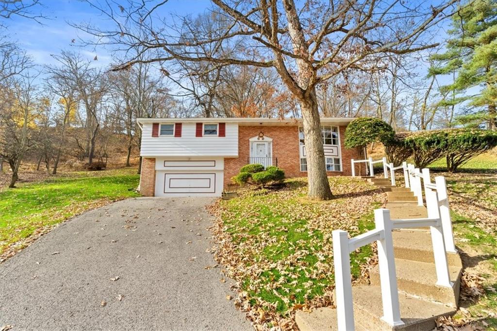 104 Dounreay Place Pittsburgh, PA 15237 - Photo 41 of 43 a front view of a house with garden