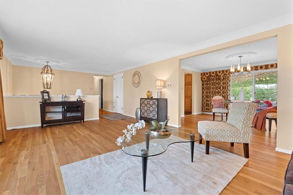 104 Dounreay Place Pittsburgh, PA 15237 - Photo 7 of 43 a living room with furniture and a wooden floor