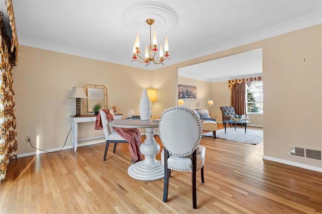 104 Dounreay Place Pittsburgh, PA 15237 - Photo 10 of 43 a view of a dining room with furniture wooden floor and chandelier