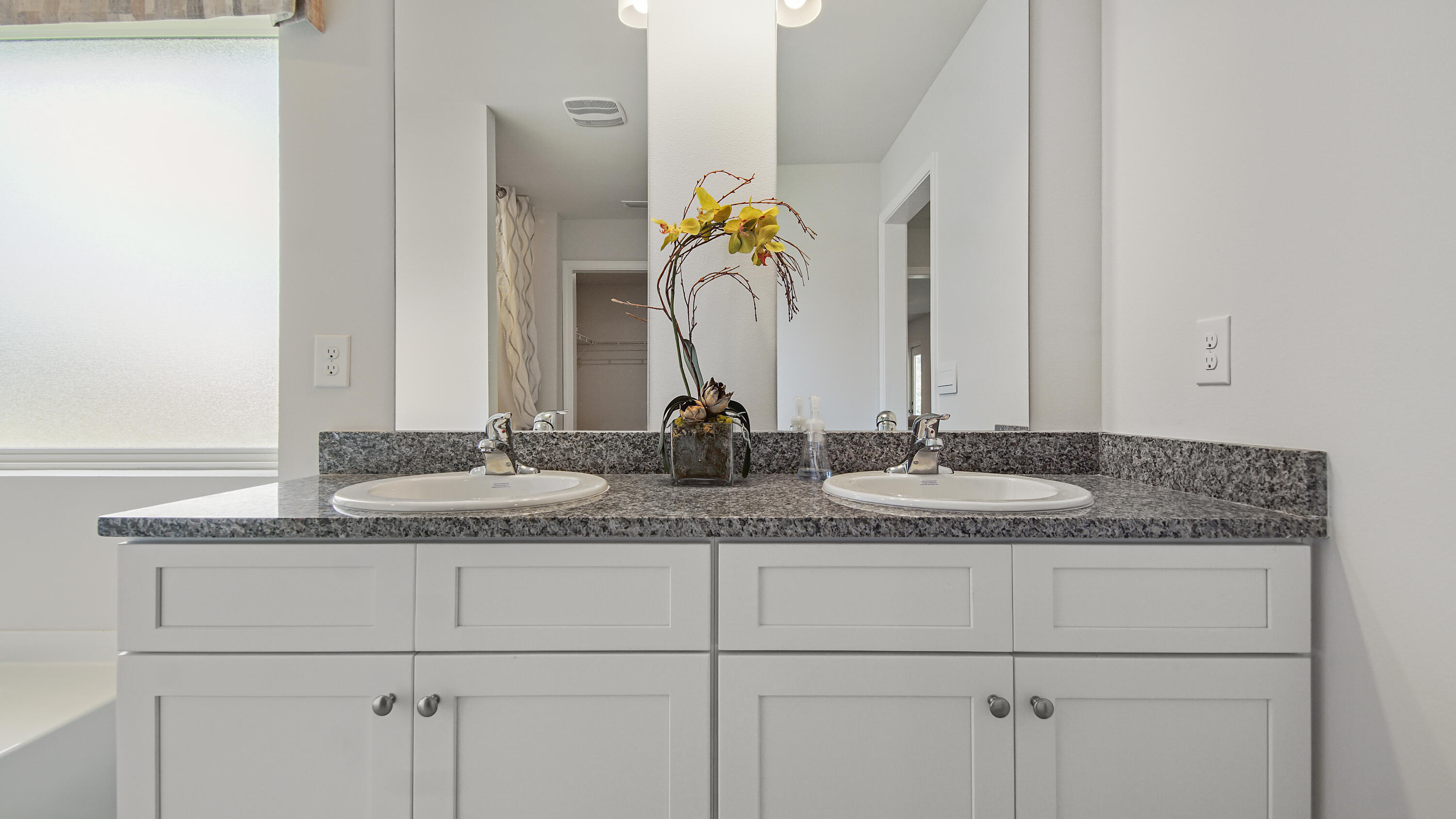 211 Gray Owl Drive Freeport, FL 32439 - Photo 18 of 35 a bathroom with a granite countertop sink and white cabinets