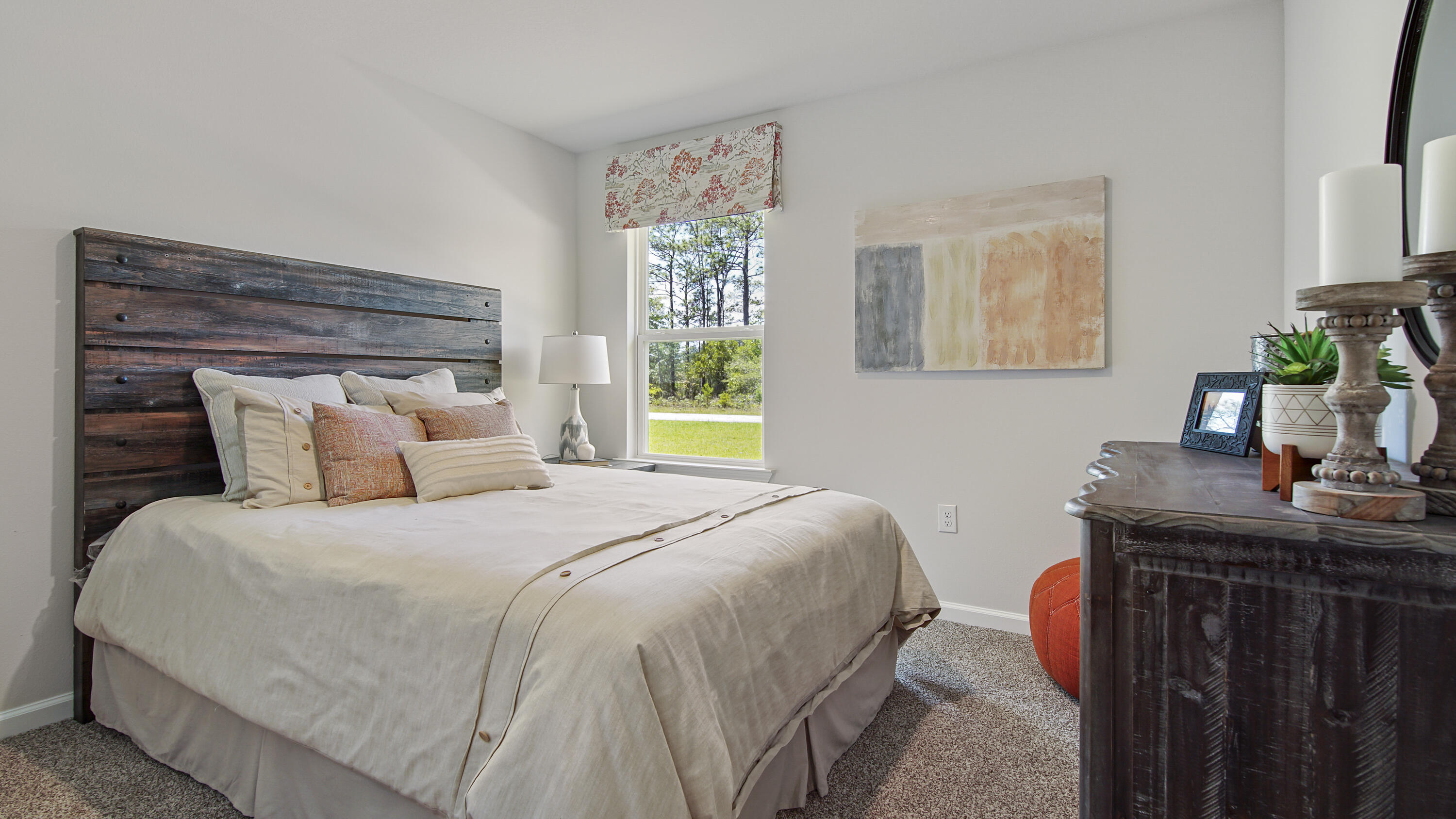 211 Gray Owl Drive Freeport, FL 32439 - Photo 26 of 35 a bedroom with a bed and a dresser next to a window