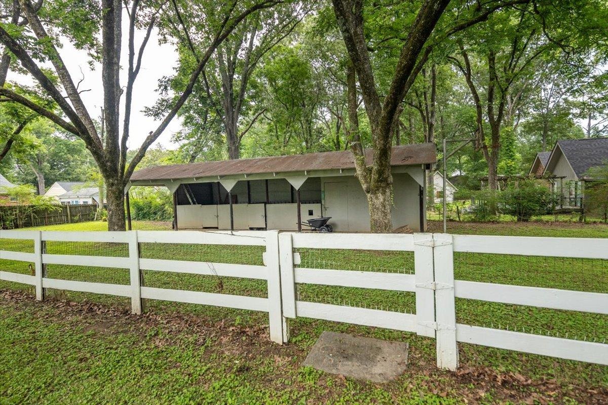 670 Peterson Lake Road Collierville, TN 38017 - Photo 31 of 37 White four-rail fence enclosing a grassy area