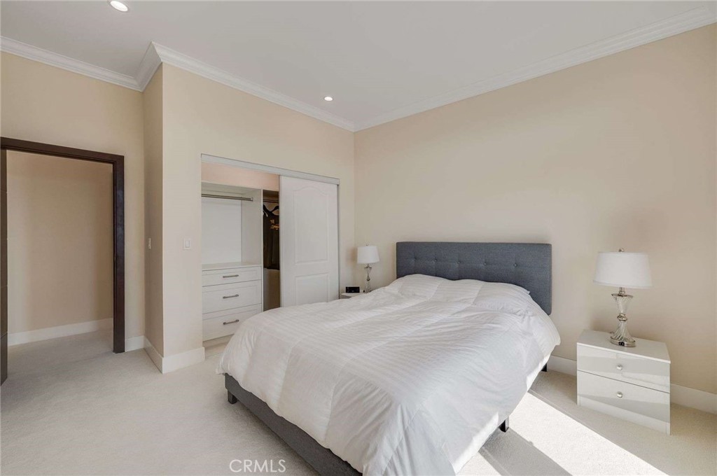 11837 Rideout Way Whittier, CA 90601 - Photo 33 of 44 a bedroom with a bed and a lamp
