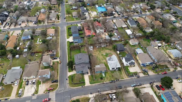 an aerial view of multiple houses with yard