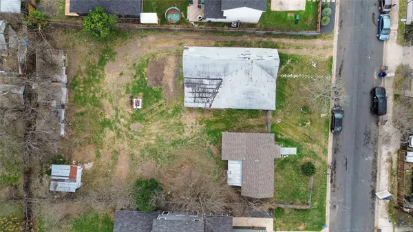an aerial view of houses with outdoor space