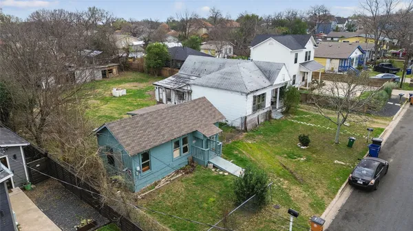 an aerial view of a house with outdoor space