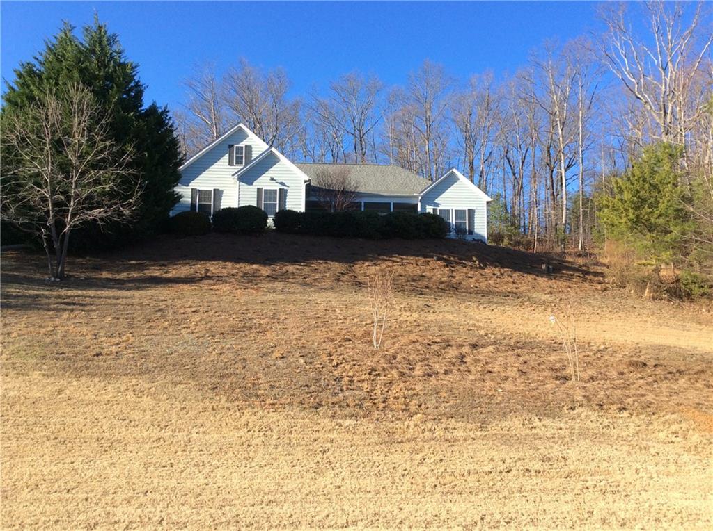 a house view with a wooden fence