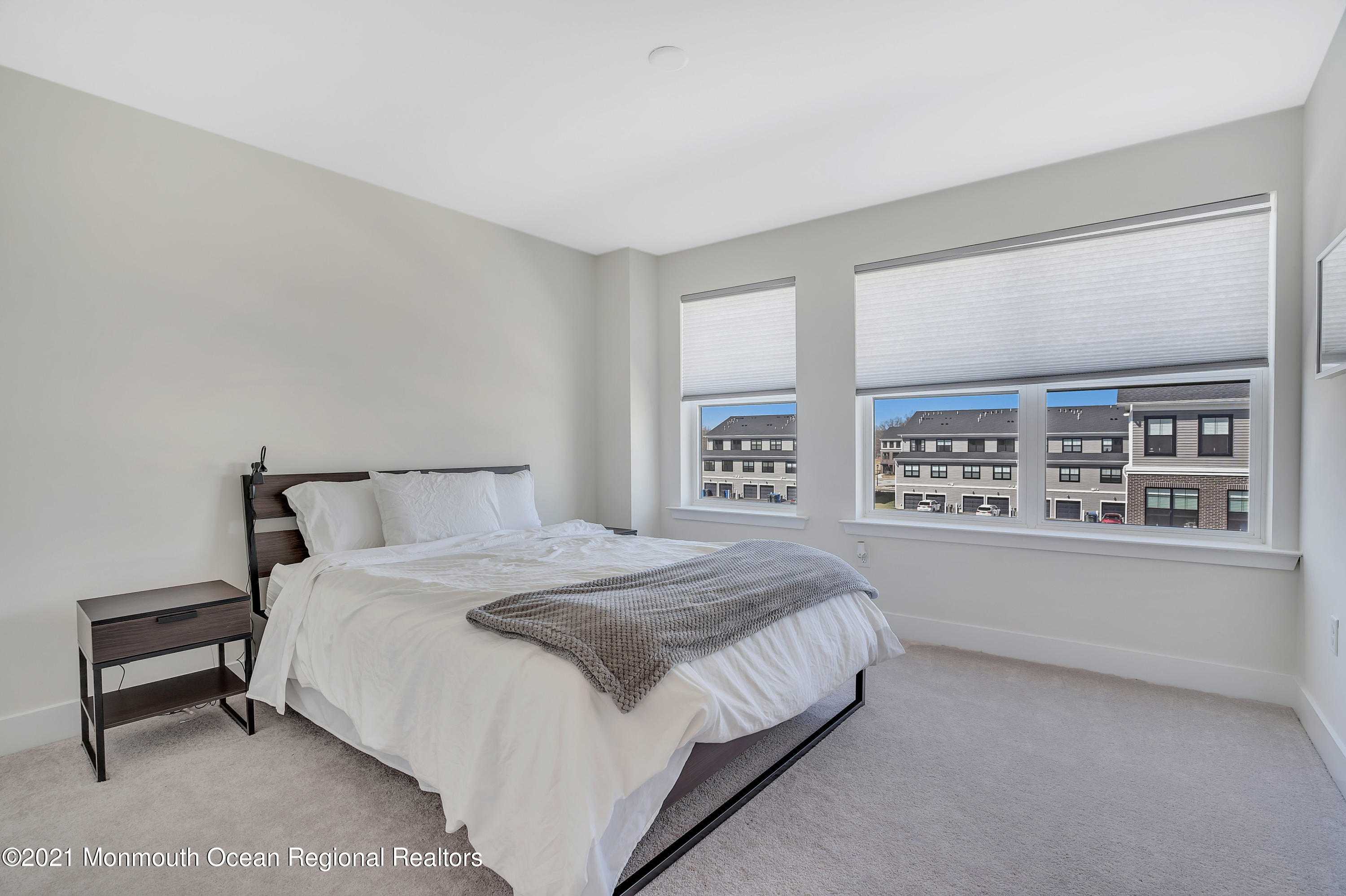 26 Kelly Way Tinton Falls, NJ 07724 - Photo 26 of 34 a bedroom with a bed and a night stand