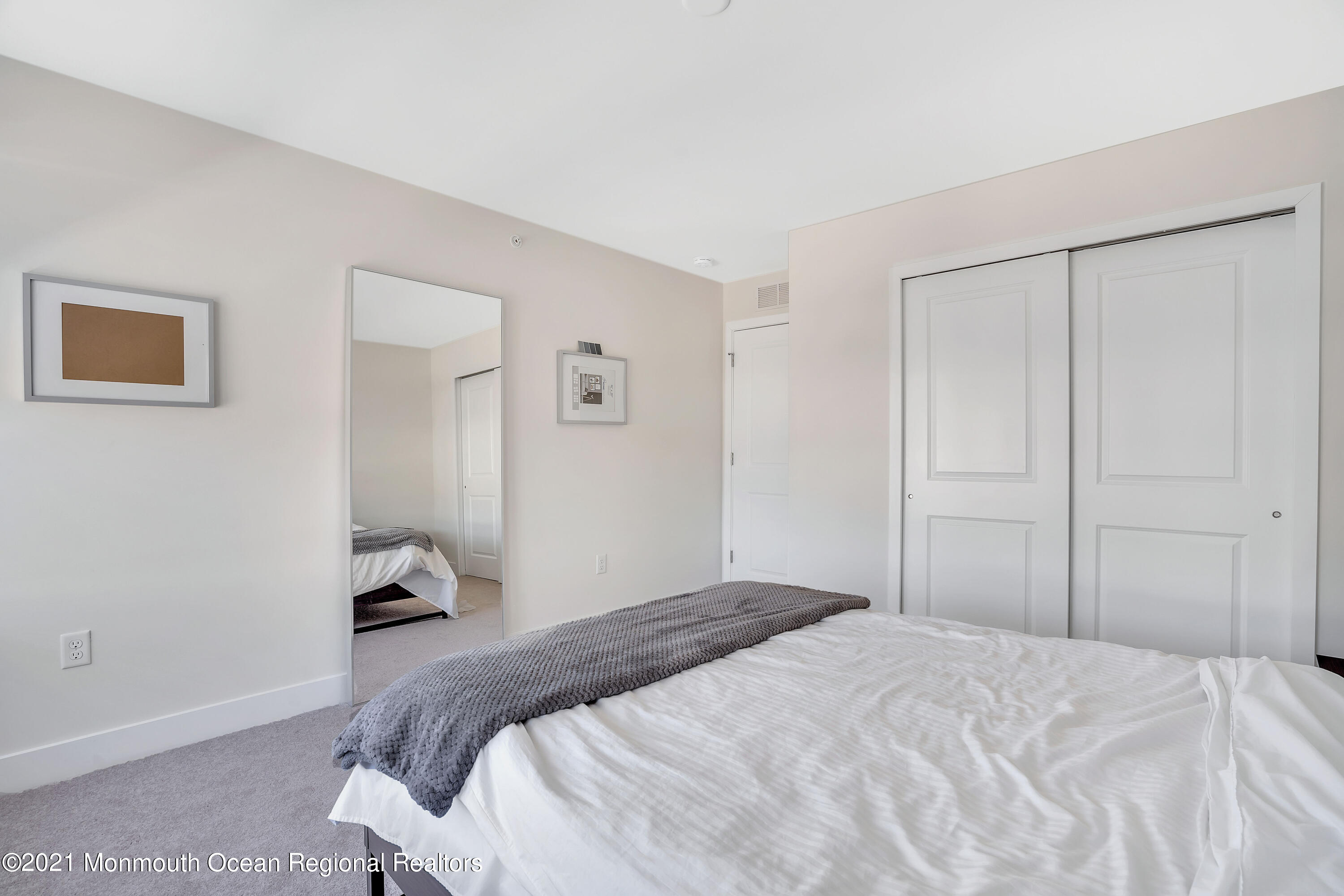 26 Kelly Way Tinton Falls, NJ 07724 - Photo 27 of 34 a bedroom with a bed and a closet