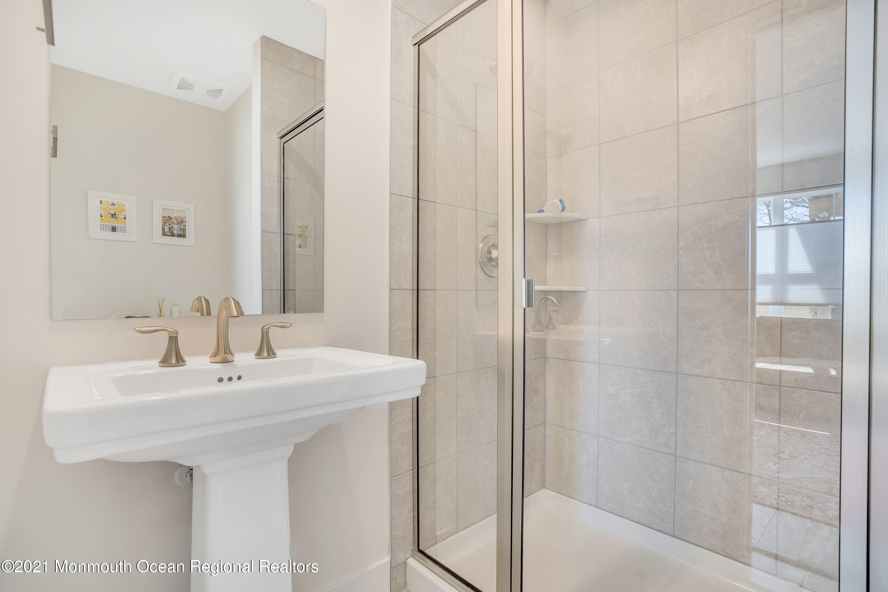 26 Kelly Way Tinton Falls, NJ 07724 - Photo 7 of 34 a bathroom with a sink a mirror and a shower