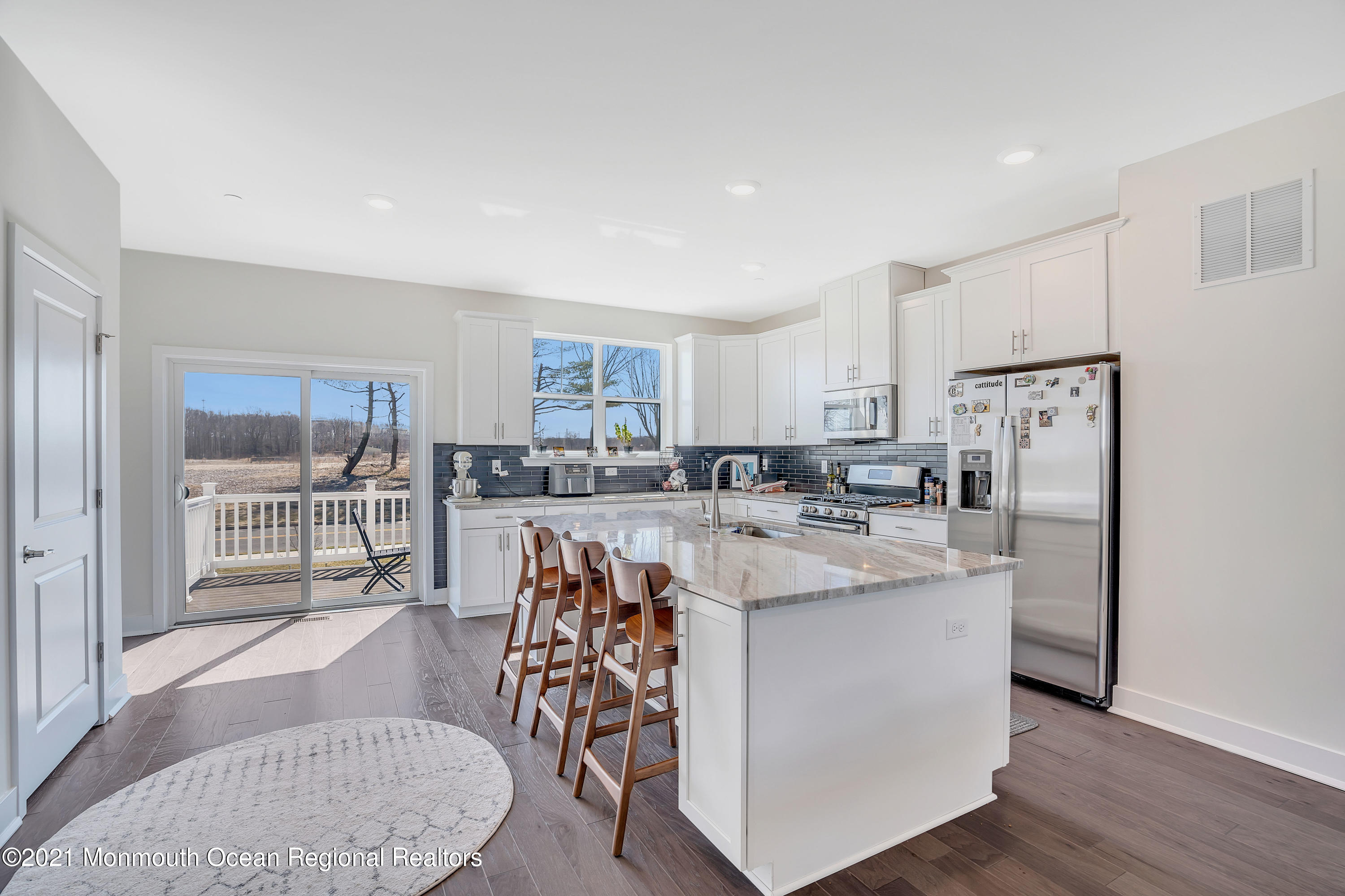 26 Kelly Way Tinton Falls, NJ 07724 - Photo 10 of 34 a kitchen with stainless steel appliances granite countertop a white cabinets and a stove top oven