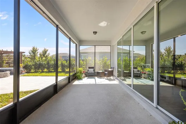 a large bed sitting in a bedroom next to a window