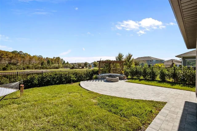a spacious bedroom with a bed and a window