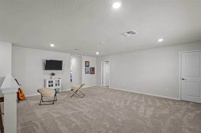 a room with a bed and a chandelier