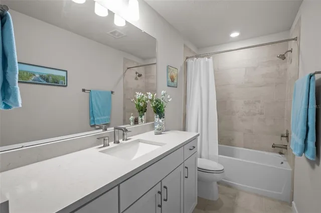 an aerial view of a house with swimming pool