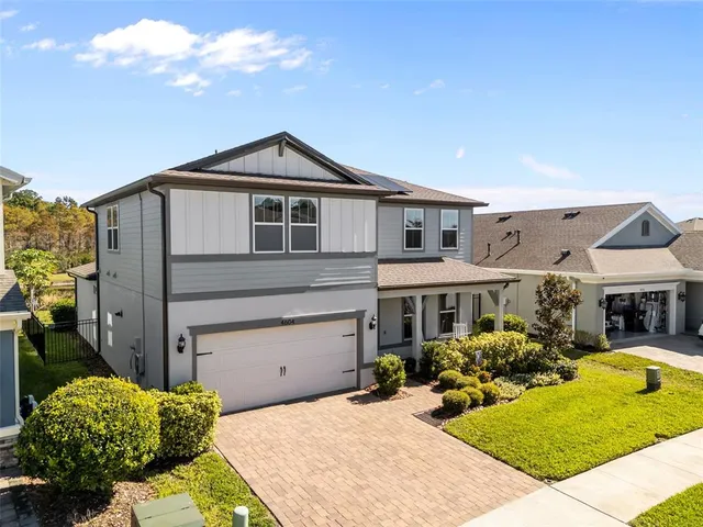 an aerial view of a house with a garden
