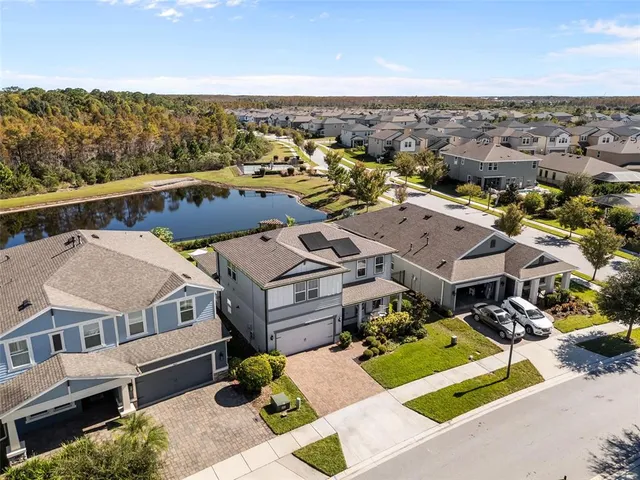 a front view of a house with swimming pool yard and patio