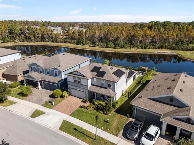 a view of a terrace with lawn chairs and wooden floor