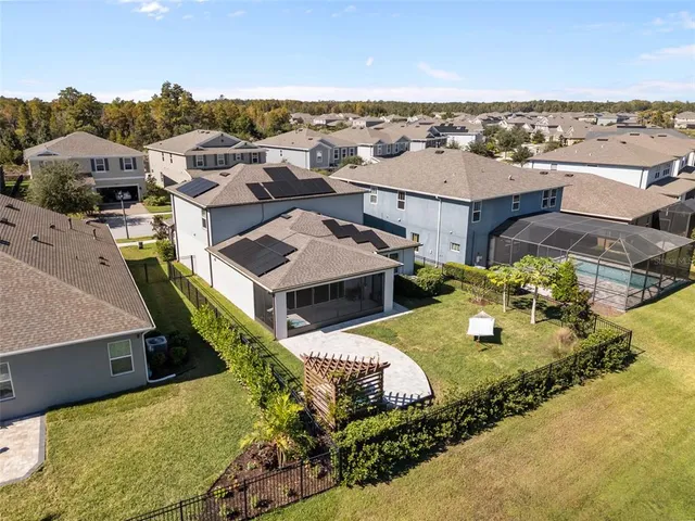 a view of a swimming pool with outdoor seating