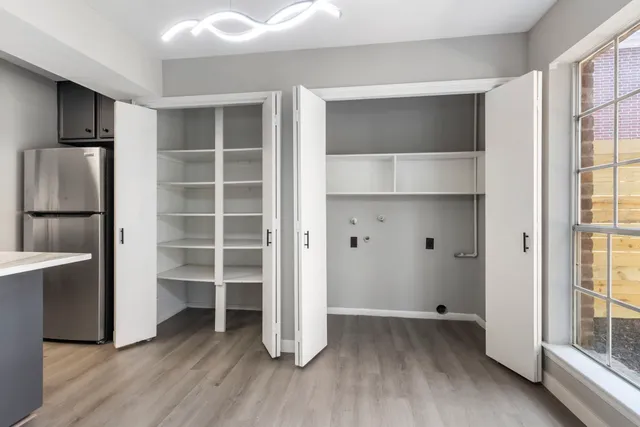 a view of wooden floor and windows in a room